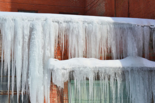 Huge ice dam formation on a home.