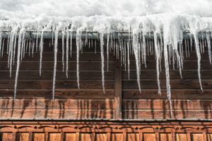 Ice dam formation on the eaves of a home.