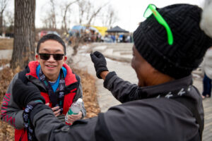 Participant receives a finisher medal at race